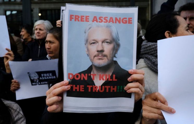 Julian Assange’s Trojan Wars With Mike Pompeo & Hillary Clinton