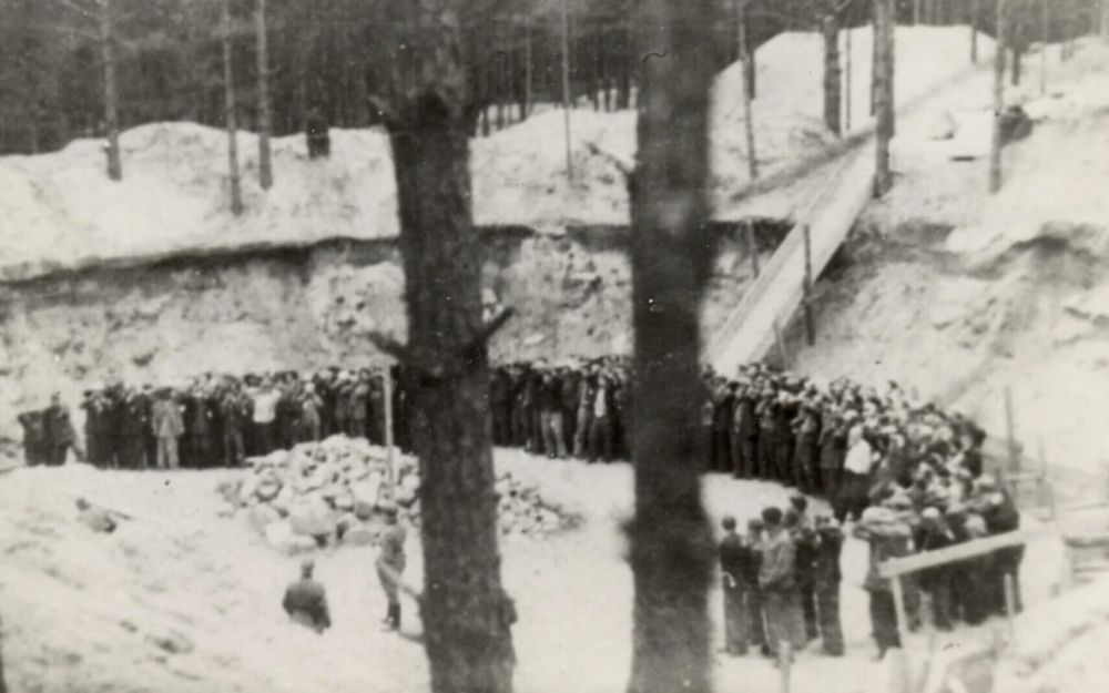 Jews being assembled by Lithuanian militiamen for execution in a ravine in the Ponar forest. German-occupied Lithuania, 1941. © Courtesy of the YIVO Institute for Jewish Research.